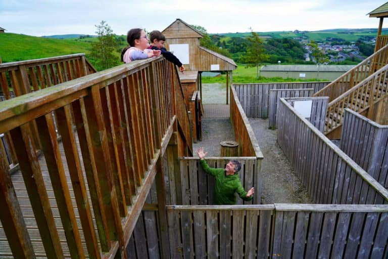 Julia & Cathal Ryan having fun looking at Geoff Wycherley getting lost in the Timber Maze at Smugglers Cove
